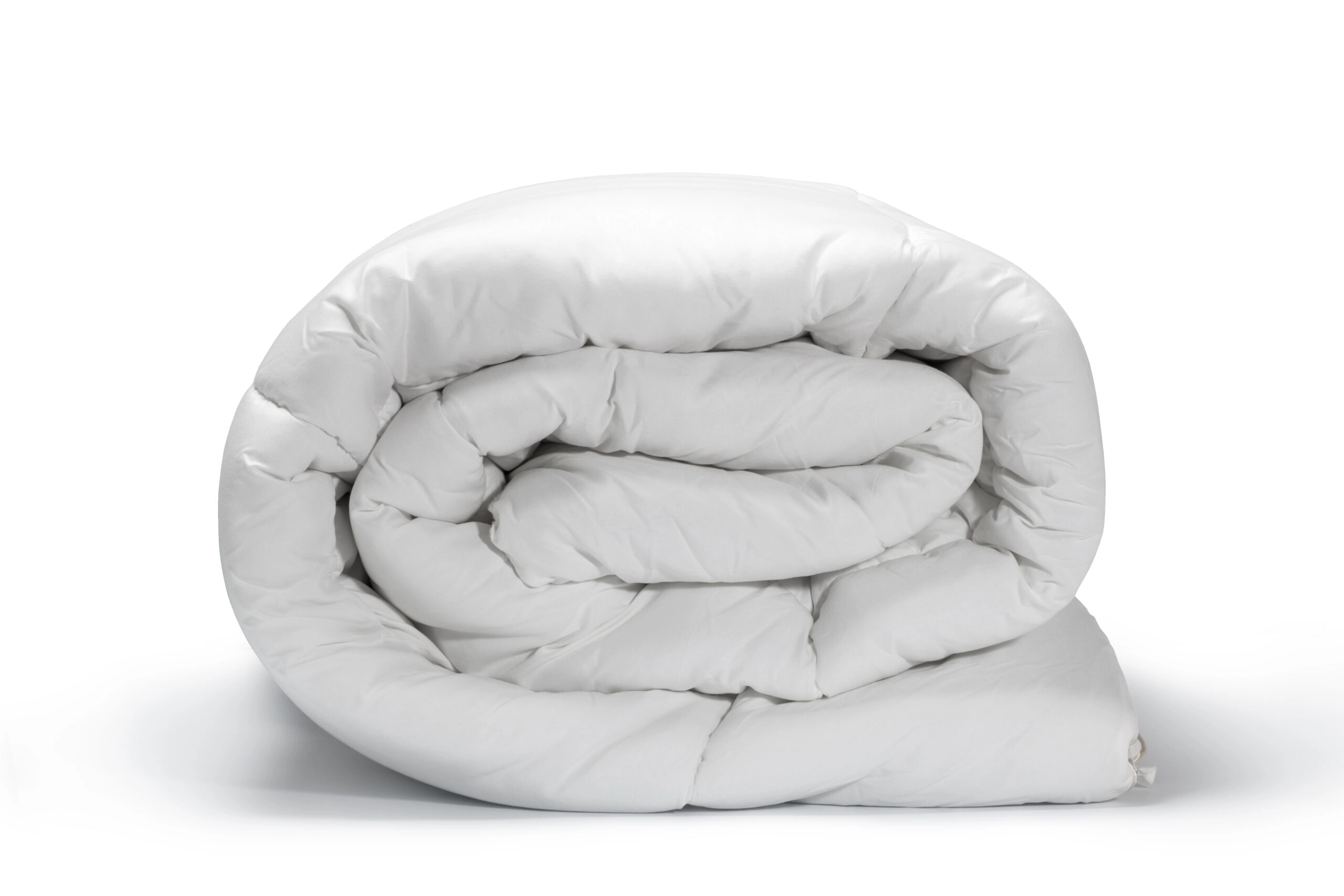 Couette blanche pliée montrant un bon entretien couette